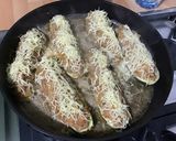 Une image de l'étape 20 de Courgettes farcies carotte jambon emmental.
