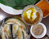 A picture of step 1 of Pabda Paturi (with Taro/ kochu/Alvi leaves) and Pabda Bhappa.