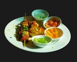 A picture of step 5 of Paneer Tikka with colorful veggies.