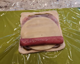 Foto del paso 3 de la receta: Enrollados de pesto y salchichas al horno