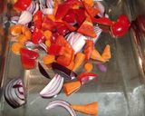 A picture of step 1 of Chop & chuck chicken & chorizo traybake.