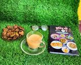 A picture of step 3 of Masala milk tea with spring onion pakoda.