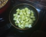 Foto del paso 4 de la receta: Carne de cochino con garbanzos y papas al mojo hervido