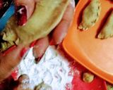 A picture of step 4 of Aata dudh puli or coconut stuffed whole wheat rice dumpling.