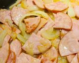 A picture of step 2 of Eggs with Canadian Bacon.
