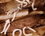A picture of step 6 of Wedged potato jackets served with veges.