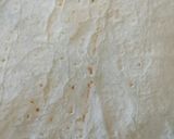A picture of step 5 of Quick chilli, bean n salad wrap.