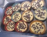 A picture of step 4 of Orange Cup Cakes 🍊 with chocolate chip.