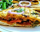 A picture of step 11 of Paneer stuffed kulcha sandwich.