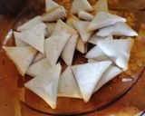 A picture of step 4 of Samsa with pastry sheets stuffed with almonds.