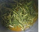 A picture of step 1 of Rajasthani dry gawarphali sabji.