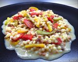 Foto del passaggio 6 della ricetta Fregola sarda con peperoni, datterini confit e gorgonzola