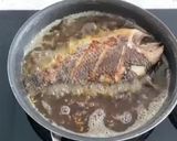 A picture of step 1 of Fried Tilapia With Crispy Garlic.