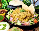 A picture of step 4 of Uttar Pradesh Urad Daal Aur Naye Chawal ki Khichdi Aloo Bharte Aur Hari Chutney (dinner or lunch).