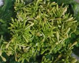 Foto langkah ke 1 dari resep Tumis Pedas Daun dan Bunga Pepaya.