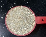 A picture of step 1 of Daliya Pulao.