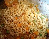 A picture of step 8 of Jollof Vegetable noodles with fried eggs.