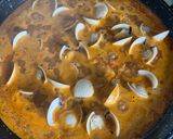 A picture of step 6 of Seafood Paella with Socarrat.