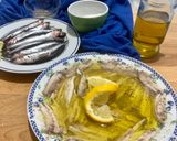 A picture of step 7 of Microwave Marinated Anchovies with Olive Oil, Lemon, Salt, and Pepper.