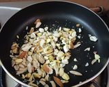 A picture of step 3 of Rava besan dry fruit laddu.