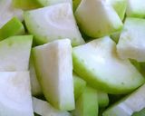 A picture of step 1 of Ash gourd mung dal Poricha Koottu.