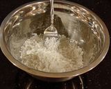 A picture of step 2 of Coconut Macaroon s with a Chocolate Center.