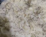 A picture of step 5 of Pasta in white sauce with garlic bread.