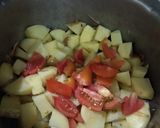 A picture of step 3 of Alu Anday gravy.