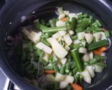 A picture of step 3 of Sambhar rice.