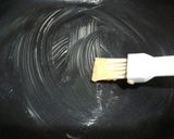A picture of step 4 of 5 minute cake in frying pan(Swiss roll).