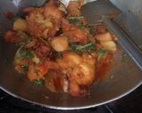 A picture of step 28 of Aloo fulcopi katla rosha ar misti doi.