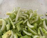 A picture of step 1 of Celery with Avocado and Green Onion.
