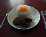 A picture of step 8 of Carrot rice with deep fried chicken.
