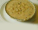 A picture of step 4 of Drum stick tomato masala curry (sambar) mixed with rice.