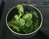 A picture of step 1 of Baked eggs and spinach.