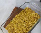 A picture of step 2 of Pineapple delight with m&m bunties.