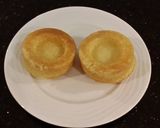 A picture of step 14 of Vanilla Butter Cakes filled and Frosted with Whipped White Chocolate Rasberry Ganache.