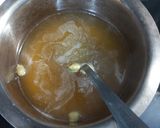 A picture of step 2 of Jaggery semolina makhany ka halwa.