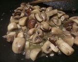 A picture of step 2 of Sauteed mushrooms and wilted spinach in garlic butter.