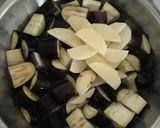 A picture of step 1 of Brinjal potato curry.