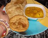 A picture of step 7 of Potato veg with pooris.