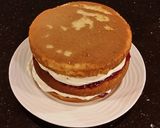 A picture of step 20 of Vanilla Lemon Raspberry Layer Cake with Whipped Cream Buttercream Frosting.