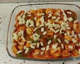Foto del paso 8 de la receta: Cappellettis de jamón con pasas, salsa de tomate y gratinados con queso viejo