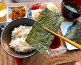 A picture of step 3 of Japanese Breakfast (how to eat Nori seaweed and rice).