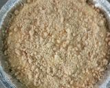 A picture of step 5 of Cheesecake with crumbles.