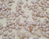 Foto del paso 11 de la receta: 179. Coca de San Juan de hojaldre, crema y piñones