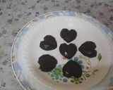 A picture of step 3 of (meethi recipe)Small pinnata heart shape dark chocolates.