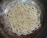 A picture of step 2 of American chopsuey with fried rice.