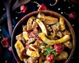 A picture of step 5 of Nariyal Gosht.