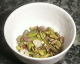 A picture of step 2 of Mawa apple stuff with dryfruits (sweet dish).